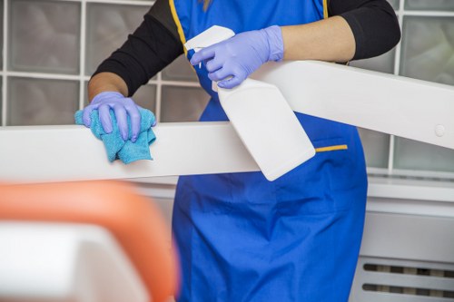 Oven cleaning specialist wearing protective gloves and eye protection